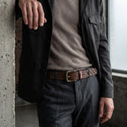 Berbanto Rustline espresso brown studded leather belt styled with tailored trousers and blazer.